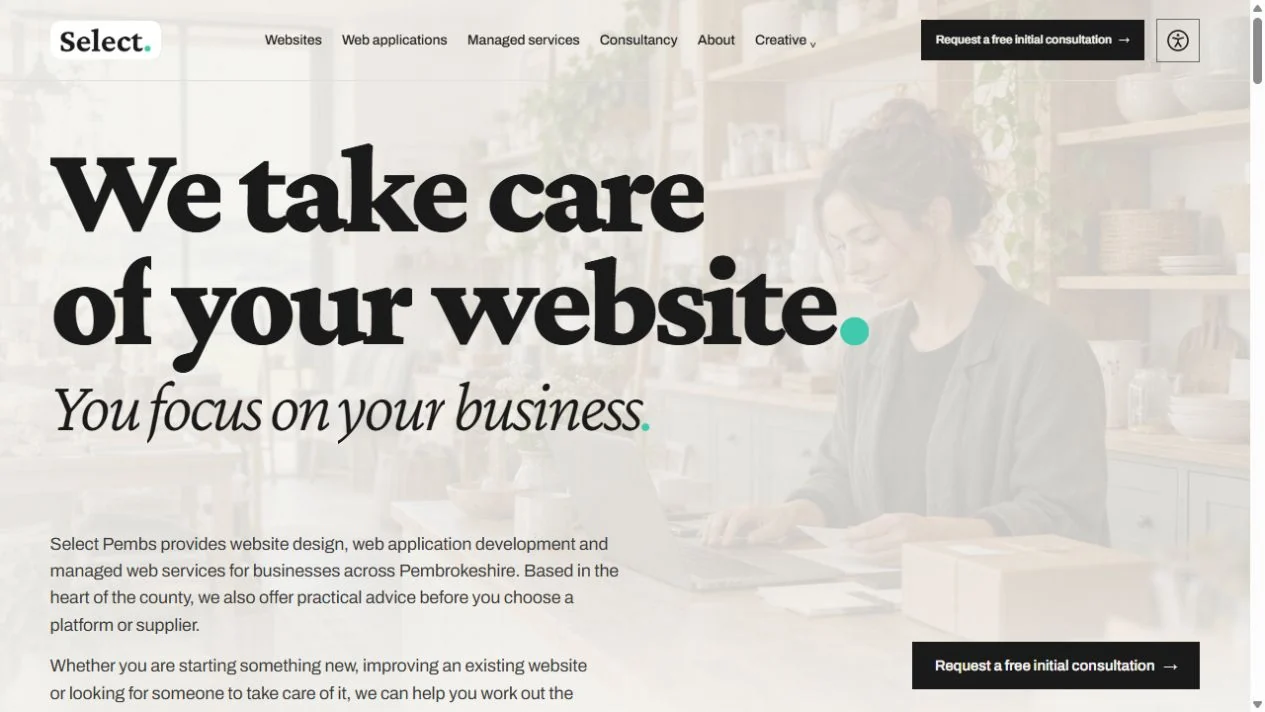 Select Pembs homepage with large editorial typography, the teal brand full stop and a faint shop photograph.